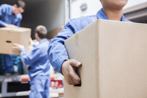 Professional flat removals in Watford with moving team and packed boxes