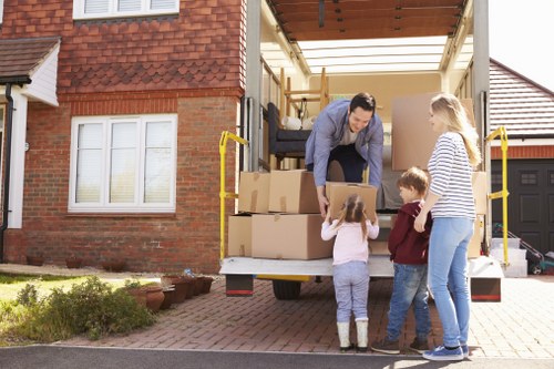 Professional house removalists loading furniture in Watford