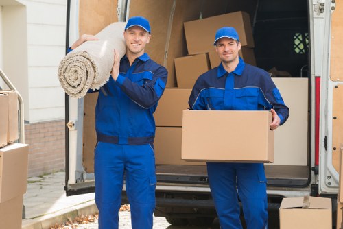 Man with van loading furniture in Watford