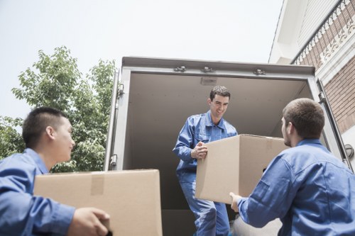Man with a van in Watford loading furniture for a local move