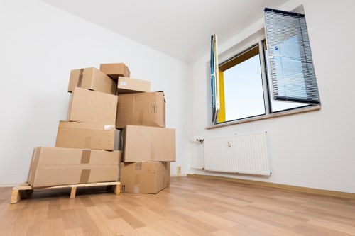 Student packing belongings for a Watford relocation