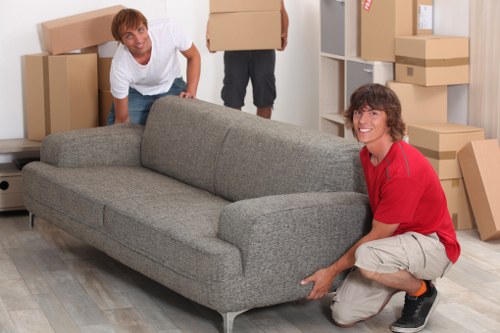 Home furniture being carefully moved during a Watford relocation