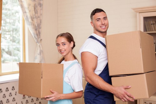 Staff wearing PPE during a careful house move
