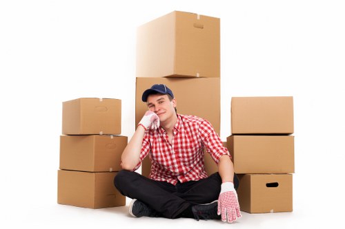 Packed office furniture and equipment ready for transport in Watford