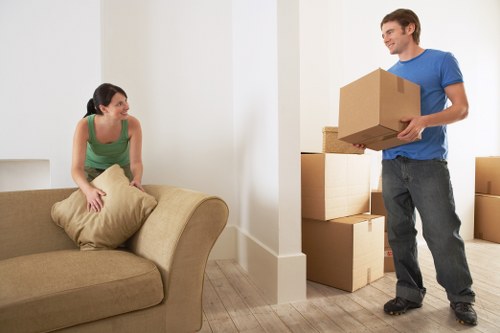 Carefully packed moving boxes and household items ready for relocation in Watford
