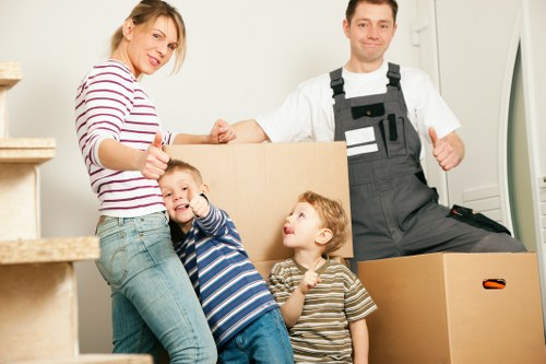 Unpacking service arranging boxes in a new Watford home after moving